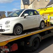 A white Fiat 500 was seized by police officers in Tetbury on Saturday, April 20