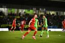 Swindon Town attacker Dan Kemp celebrates scoring the Robins' equaliser