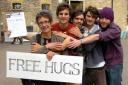 Campaigners give free hugs to car park charge petitioners