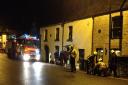 Firefighters prepare to pump out a house in Malmesbury last night
