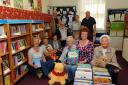 Sue Coakley, second from right, front, pictured with volunteers Hilary Hull, Hermione De Iongh, Martin Hall, Simon Winckles, Linda Kent, Annie Whistler, Barbara and John Knott and Verna Reay at Lechlade library