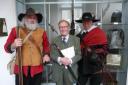 Robert Hardy unveils the collection, flanked by members of the Sealed Knot