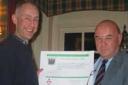 Mark Whittering makes Ian Harvey, left, Cirencester Hockey Club's first honorary life member