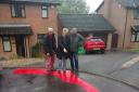 Residents bewildered as workers paint road bright red