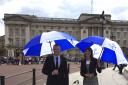 Kate Richards and Douglas King outside Buckingham Palace