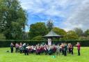 Oelixdorfer Musikzug and Cirencester Band performing together at the Abbey Grounds Park Bandstand in Cirencester on Sunday, August 13