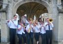 Malmesbury Concert Band performing in Market Cross in June