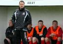 Cirencester Town boss Brian Hughes looks on anxiously