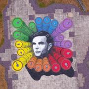 Commemorative artwork of Alan Turing outside the GCHQ headquarters building. The giant artwork of Mr Turing has been installed at the heart of GCHQ as the wartime hero becomes the first LGBT person to feature on a UK banknote