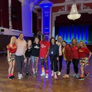 The CDC community wellbeing team with Cllr Nikki Ind, chair of the council, and Angela Claridge, monitoring officer, with Mr Motivator and his Motivators