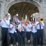 Malmesbury Concert Band performing in Market Cross in June