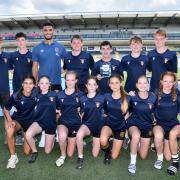Malmesbury Year 10s after their success in the Touch 2
Twickenham competition at Sixways, with Love Island star Kai Fagan (two in from back left)