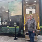 Town mayor Gavin Grant in front of the Lloyds banking bus