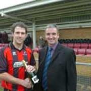A class act - Lee Molyneaux, left, receives the Standard's Player of the Month award from Cirencester Town chairman, Steve Abbley