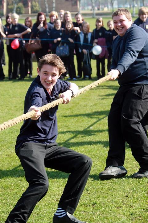 Smiles of victory for Year 11 boys as they defeat their teachers in the tug-of-war tournament at Cirencester Deer Park school, just one of several events at the school in aid of Sport Relief wgrp0474v12 To order this picture call 01285 642642 or visit wi