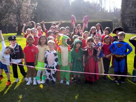 Children at Bibury Primary School line up in fancy dress ready to start their Sport Relief mile
