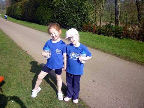 Lexie Young and Grace Major take a break from their Swell Primary School Sport Relief run at Abbotswood Garden, Lower Swell. Children from Swell school ran one of two miles and Year 2 children sold cakes at the Village coffee morning helping to raise mor