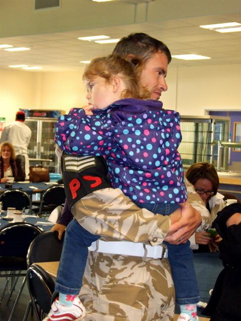 A returning member of 81 Squadron is reunited with his daughter