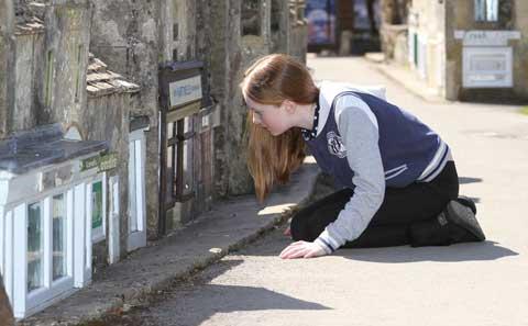 Eloise Cassidy, aged 11 from Solihull looking at the Londis shop.