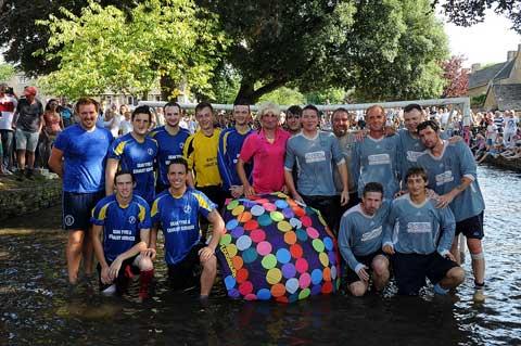 The annual Bourton Rovers charity football match in the River Windrush