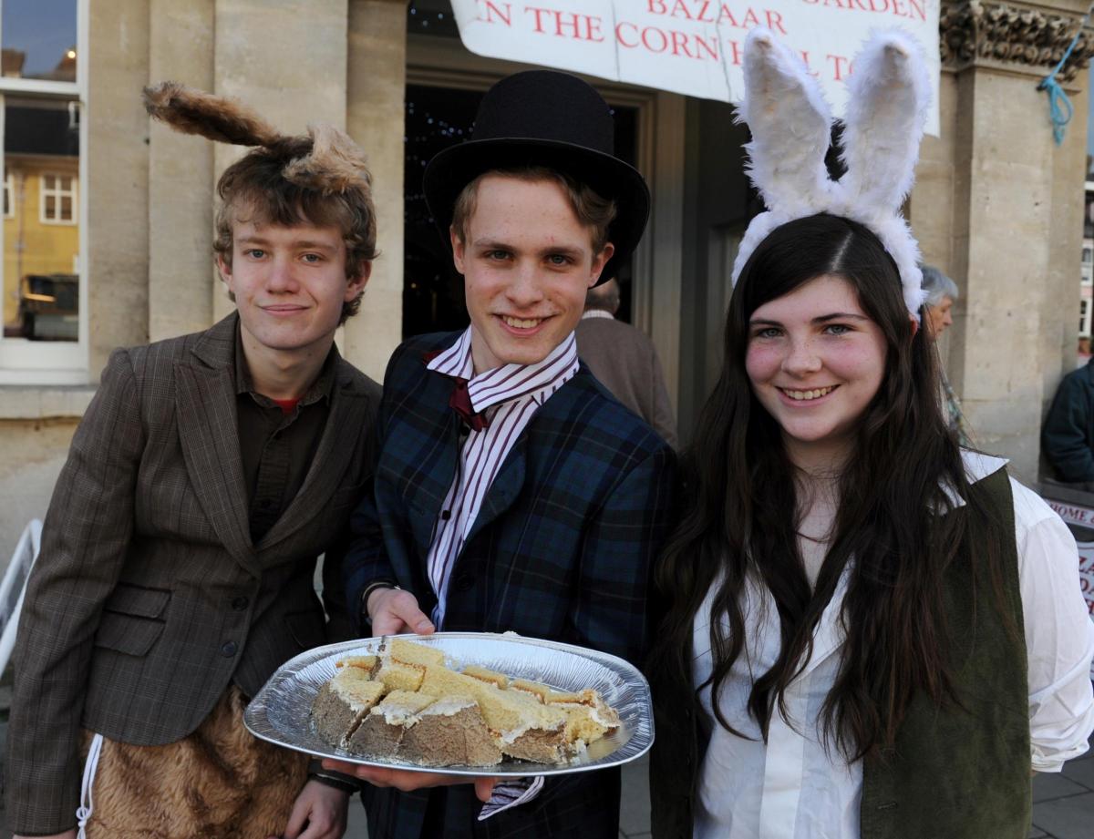 Cirencester College students Joseph Jamfrey, Jim Crawley and Emily Thomas hand out cake following the launch of the Hare Festival in Cirencester 