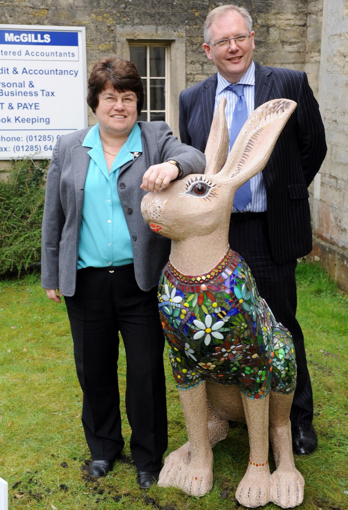 Alison Palmer and Simon Nuttall with Madame Butterfly hare by Debbie Stirling at McGills accountants in Cirencester
