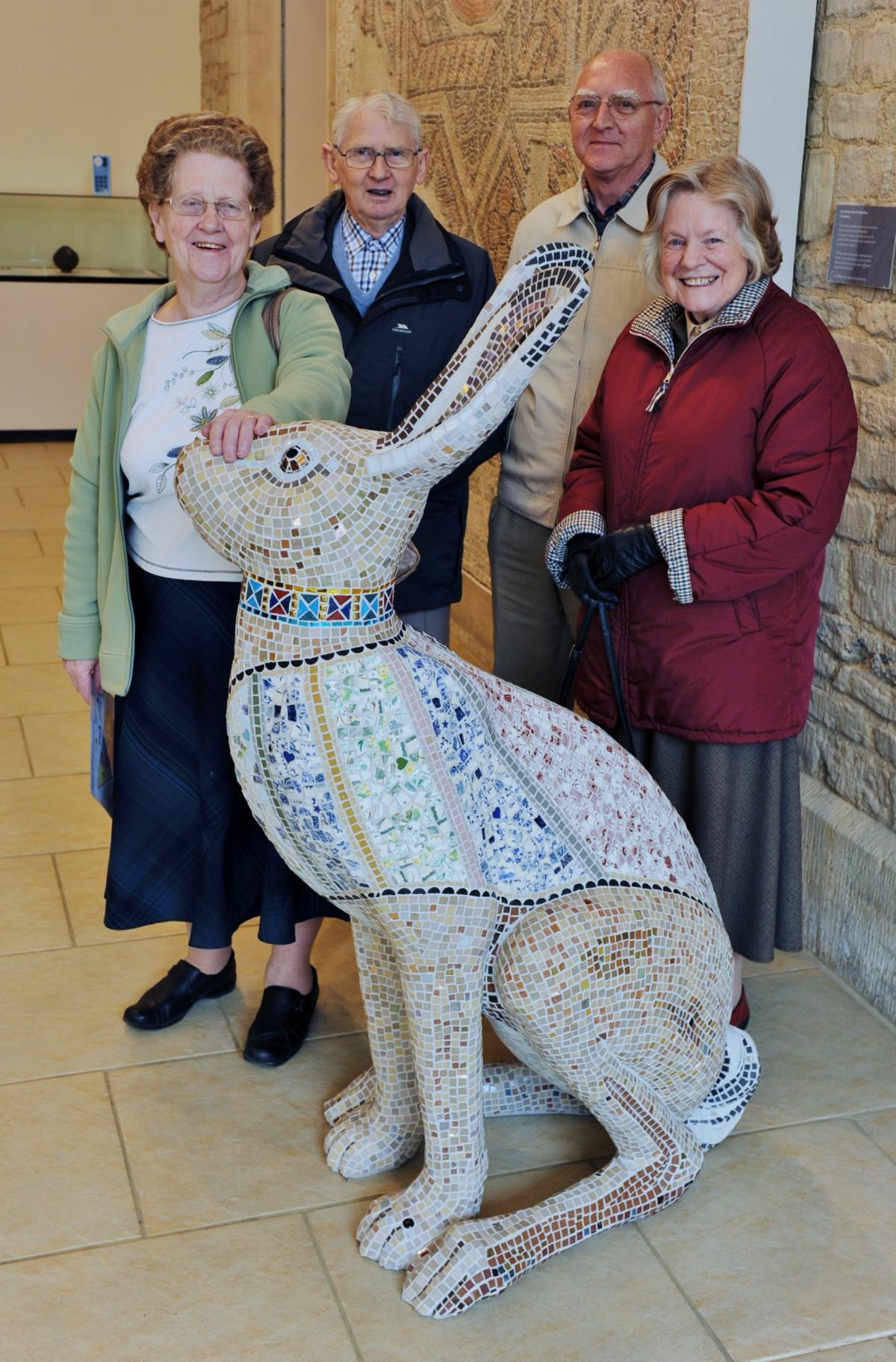 Cirencester visitors Joan and Phillip Bristow and Henry and Margaret McConnell take a look at Tess the hare by Erica Bibbings at the Corinium Museum, sponsored by BPE Solicitors