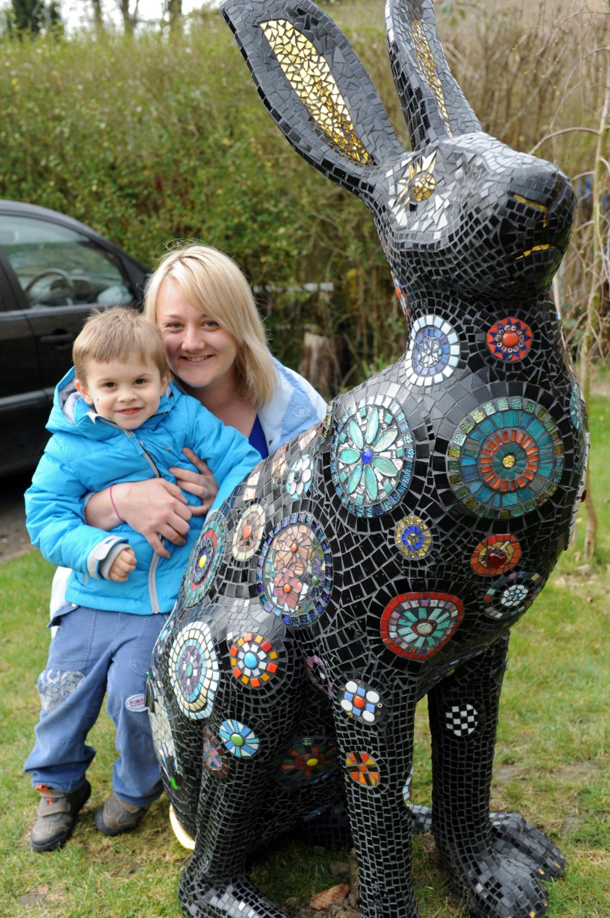 Aleksandra Zabialowicz and son Joey, 3, take a look at Hopportunity the hare created by parents of the children at Cirencester Opportunity Group
