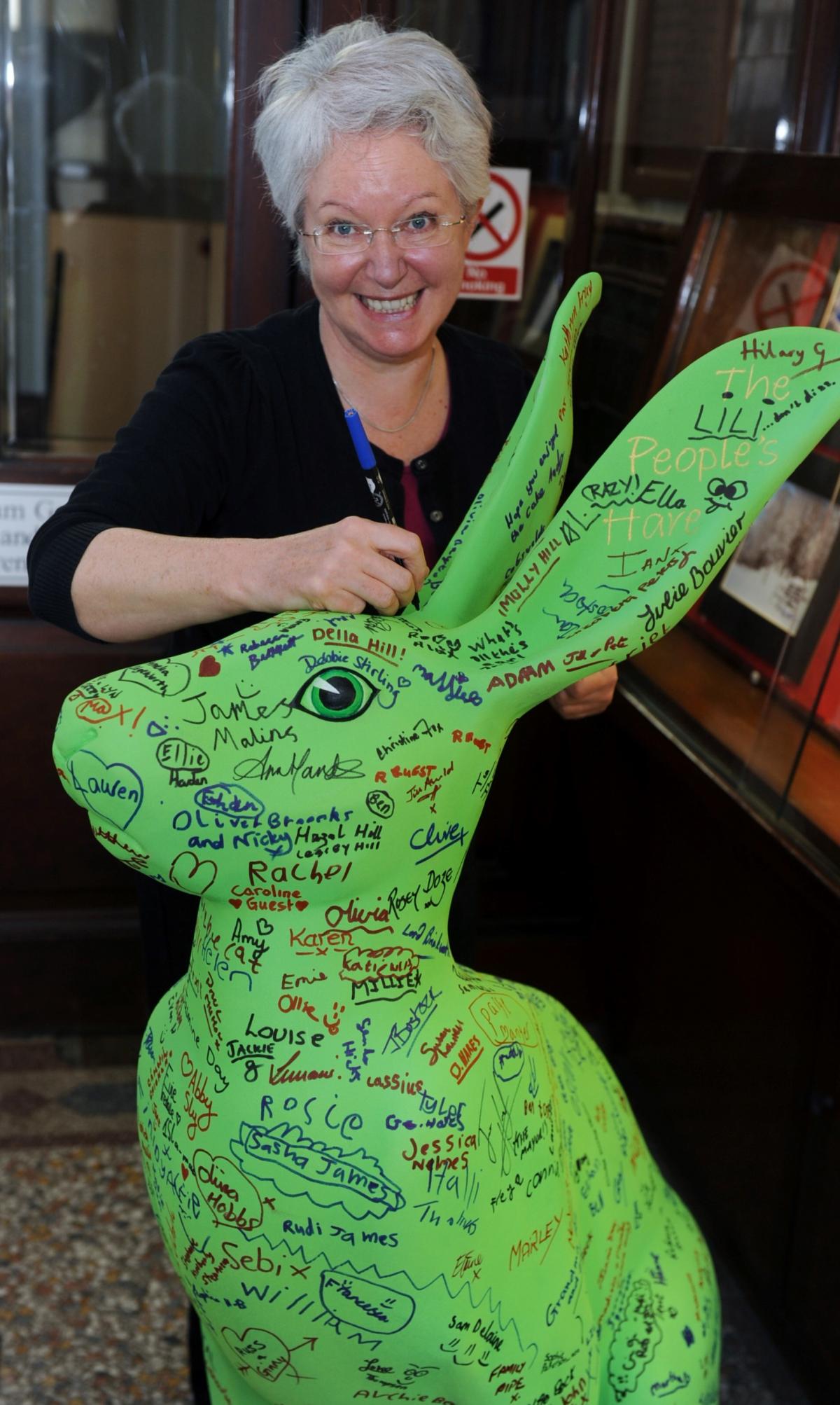 Diana Wenban signs the People's Hare at Bingham House