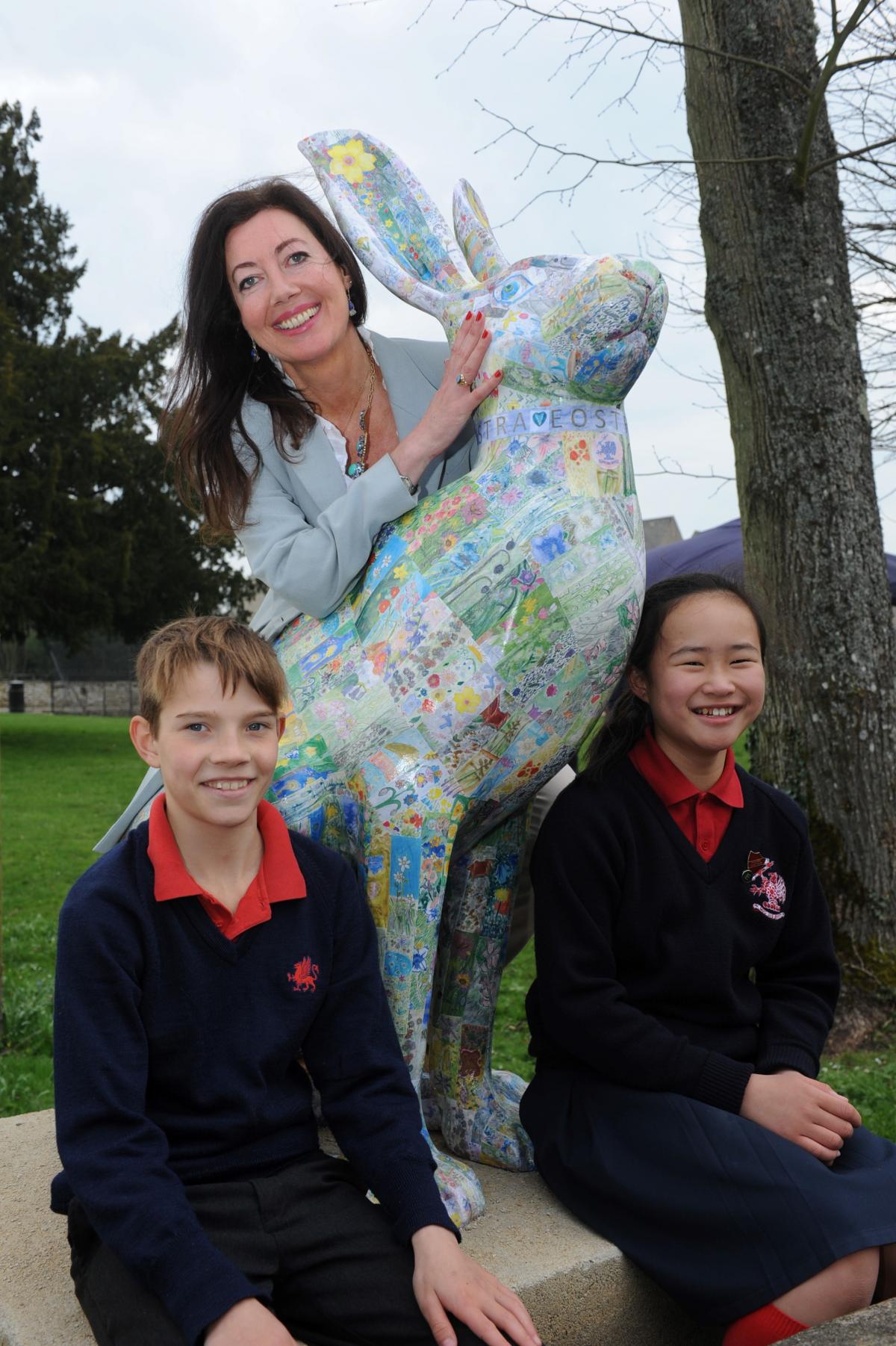 Art teacher Emma Roffe and pupils Harry Marsden, 10, and Carmen Lee, 11, with Eostra the hare at Rendcomb College