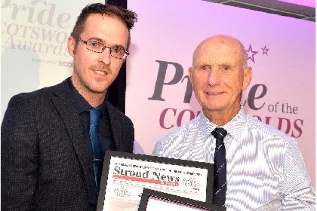 Newsquest sales director Carl Badham presents Brian Stevens with his award