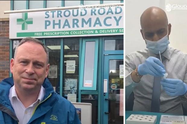 Community tester Matthew (left) outside Stroud Road Pharmacy, Gloucester, where pharmacist Dhiran (right) talks him through how to self-administer a Covid test