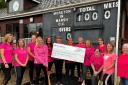 Moreton-in-Marsh ladies cricket team receiving a £1000 cheque from Persimmon Homes Wessex. 