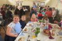 The community meal in St Peter's Hall in Cirencester