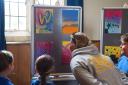 Rodmarton School teacher Mrs Thorogood joins pupils to admire their creations