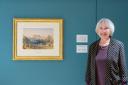 Sharon Nolan next to Turner's Malmesbury Abbey painting