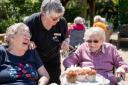 Residents and staff at The Orders of St John Care Trust enjoy time spent together