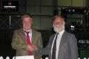 Harry Loewe from Moreton-in-Marsh is presented with the Royal Forestry Society Silky Fox Handsaw award by Rob Guest