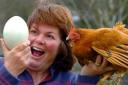 Judy Hancox at The Butts Farm with Nellie the hen and its giant egg