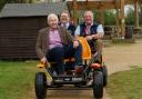 Paul Hazel and Matthew Millett from Cotswold Lakes Trust with Peter Andrew from The Hills Group in a go-kart at Cotswold Country Park & Beach in the Cotswold Water Park