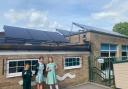 Pupils at St Joseph's Catholic Primary School in Malmesbury next to the new solar panels