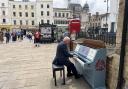 Reverend Canon Graham Morris treating the audience to some great music at the unveiling of the new street piano in Cirencester