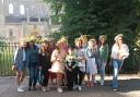 Ukrainian hosts and guests wearing flower crowns in July 2022