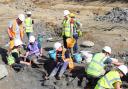 Palaeontologists excavating a mammoth tusk found at the Hills Quarry site