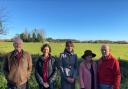 A group picture of some of the CARG members next to the proposed truck stop site