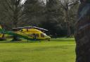 A yellow air ambulance landed in Abbey Grounds Park in Cirencester this morning