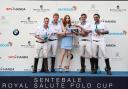 Karen Gillan of Doctor Who hands out bottles of Royal Salute Polo Edition whiskey and the trophy to Prince Harry's ISPS Handa team, after they triumphed over St. Regis. Photo by Chris Jackson/Getty Images