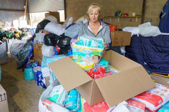 Wilts and Gloucestershire Standard: Practice manager Patricia Crichton packages the donations Wilts and Gloucestershire Standard: Practice manager Patricia Crichton packages the donations