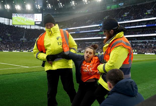 Wilts and Gloucestershire Standard: A protestor is removed by stewards at the Tottenham Hotspur stadium