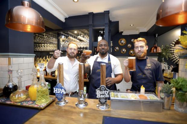 Wilts and Gloucestershire Standard: Manager Thomas Holland, bar manager Isaac Saidy and barman Charlie Wade at Henry's in Cirencester. Photo: Paul Nicholls